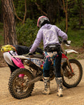 Person on a dirt bike in a forested area
