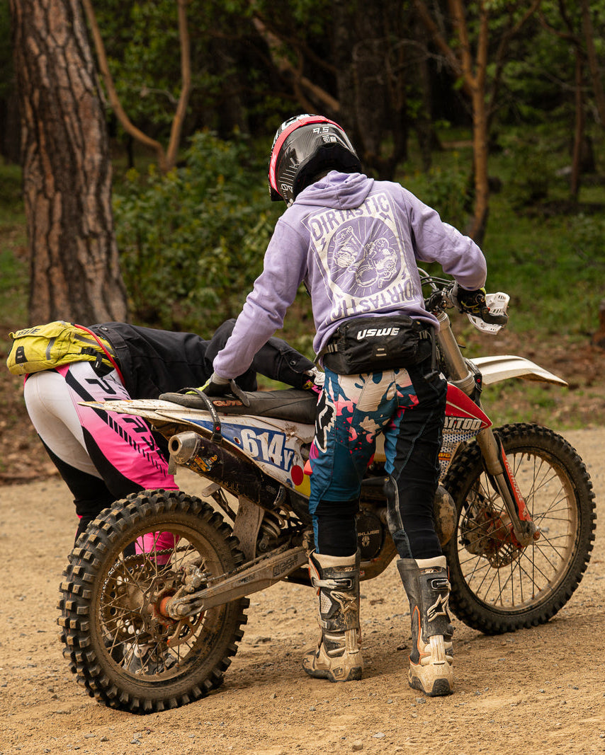 Person on a dirt bike in a forested area